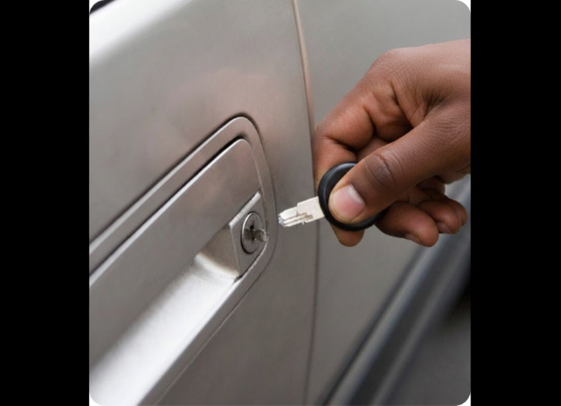 Auto locksmith extracting a broken car key