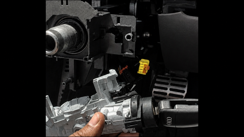 Auto locksmith repairing a car ignition