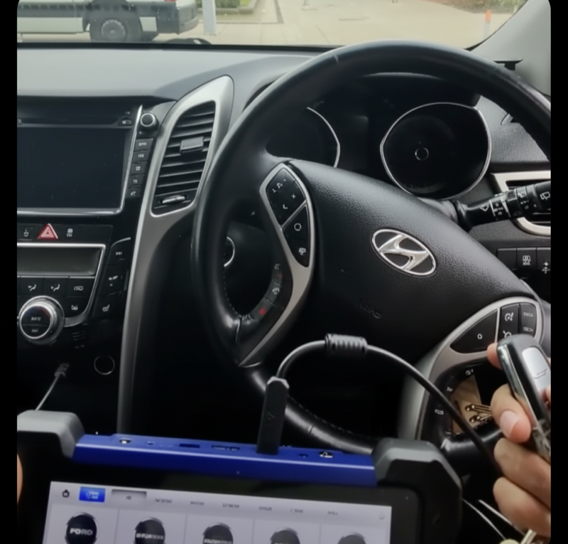 Auto locksmith programming a car smart key