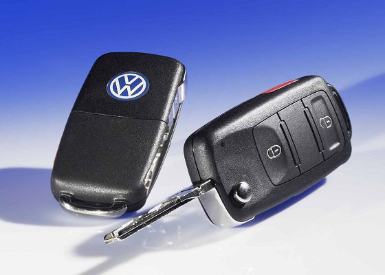 Auto locksmith holding a spare car key